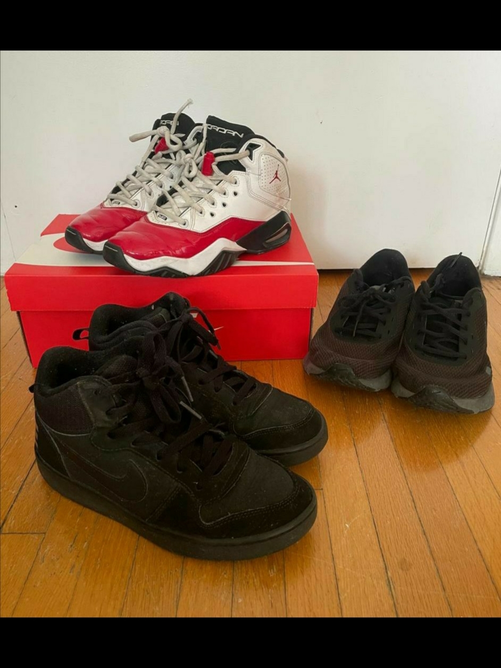 three pairs of Nike mid-top sneakers, size 5.5-6Y